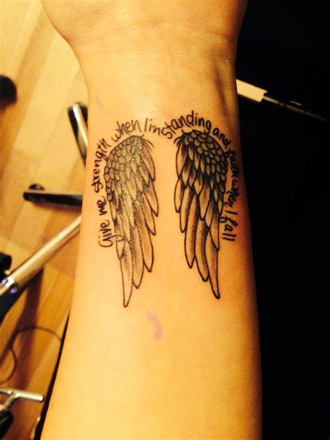 angel with wing tattoo|angel wing wrist tattoos pictures.